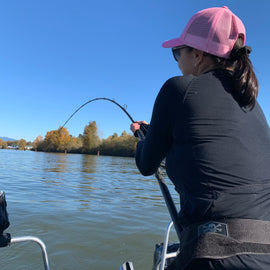 woman fights large sturgeon on the fraser river with pacific angler sturgeon fishing 